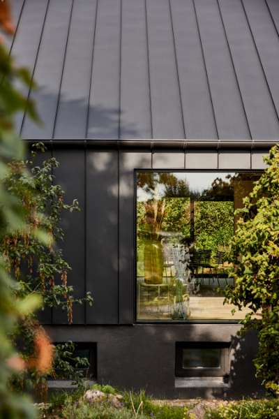 “Royal” door, found in Christiania, now installed in a steel façade, Volstrupvej 63, 9240 Nibe
